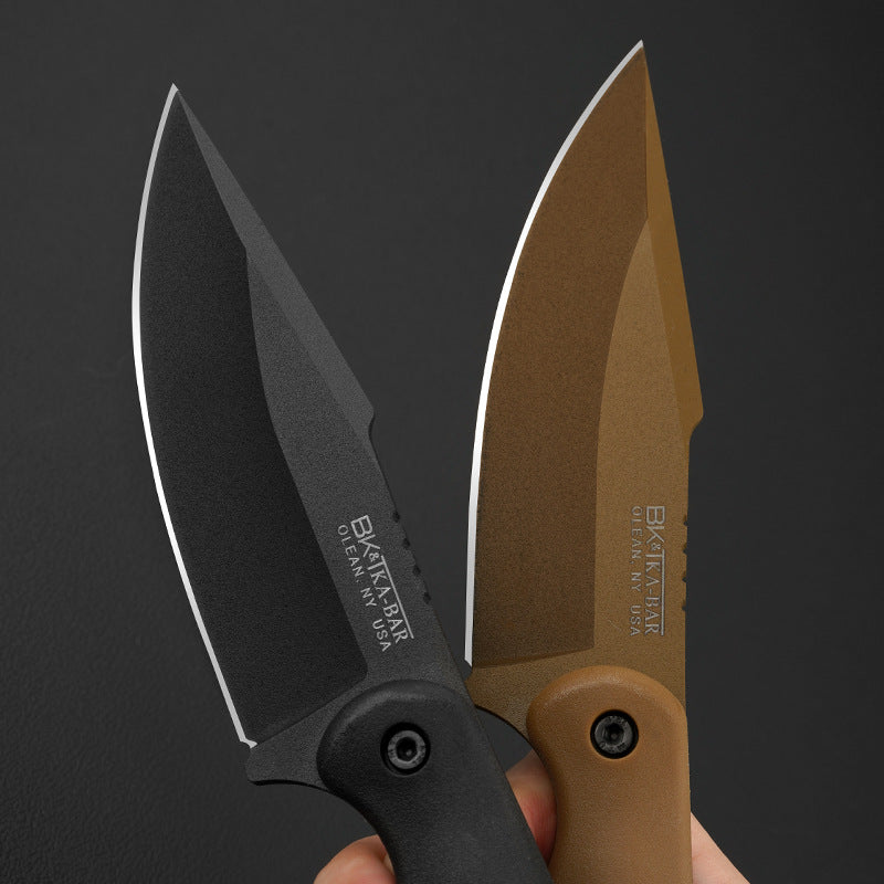 Two folding knives with black and brown handles held against a dark background