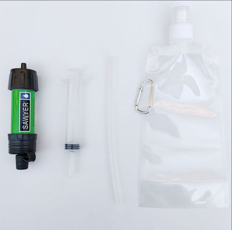 Sawyer water filter with a carabiner and clear bag on a white background