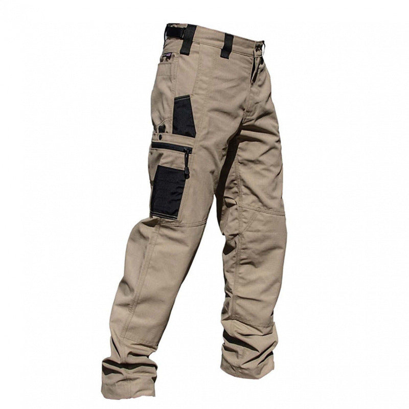 Beige work pants with black patches on a white background